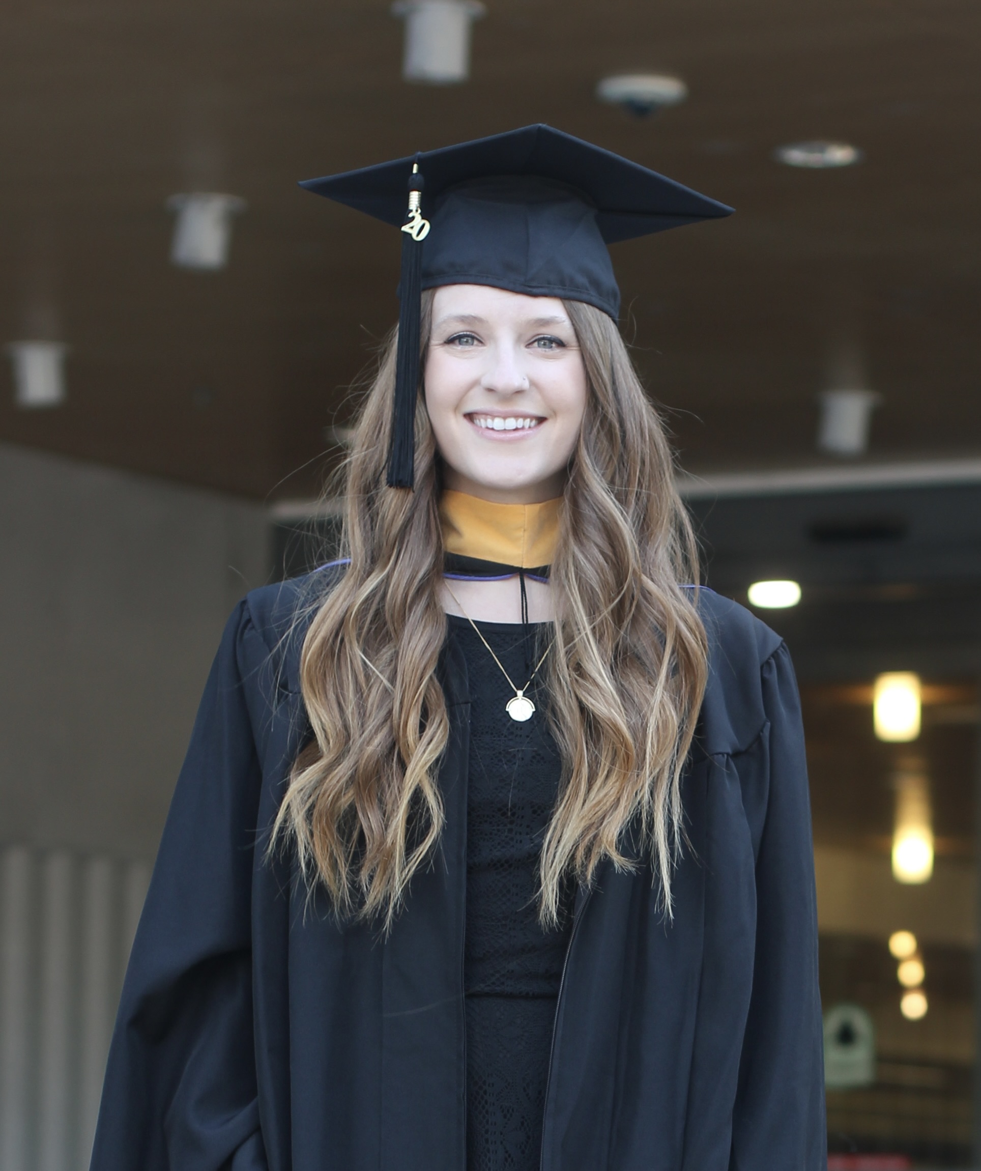Sarah Joan Fox wearing graduation regalia